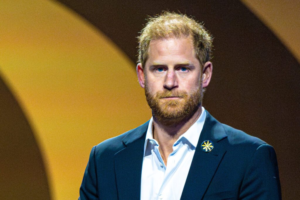 Prince Harry looks serious at event
