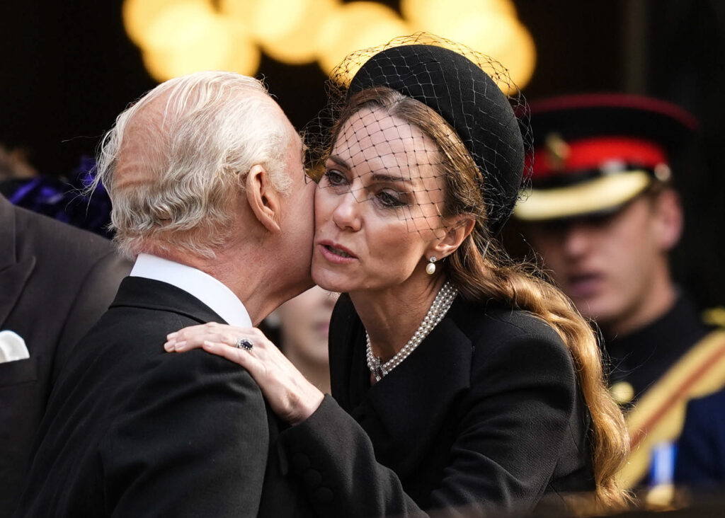 Princess Kate and King Charles sharing a kiss on the cheek
