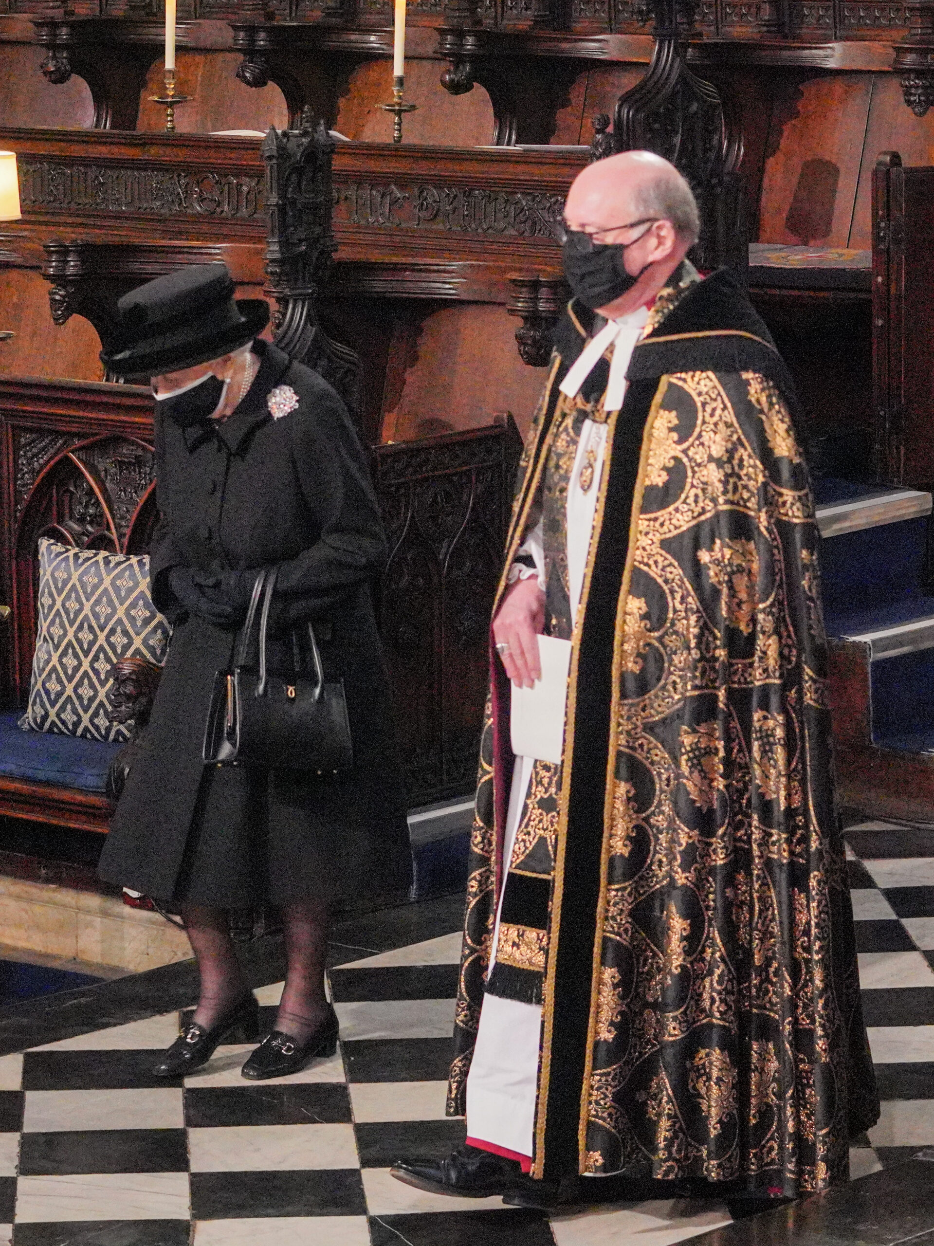Queen Elizabeth at The Funeral of Philip Duke of Edinburgh at St. George's Chapel in Windsor Castle, looking down at the floor