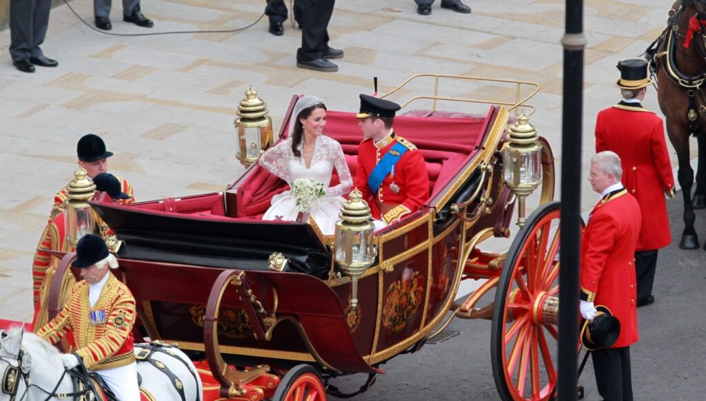 Kate Middleton and Prince William in carriage on their wedding day