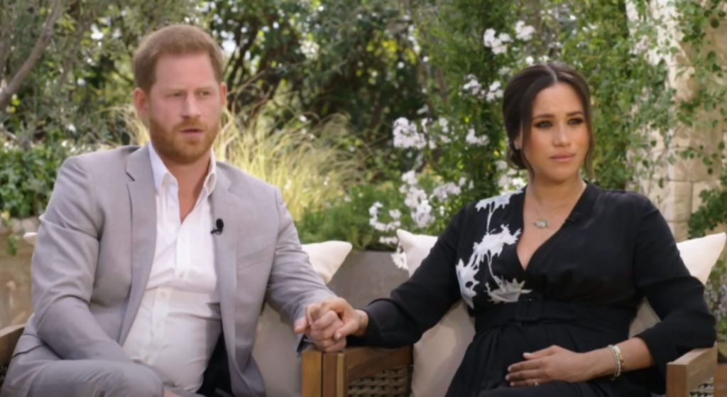 Prince Harry and Meghan Markle holding hands during Oprah interview