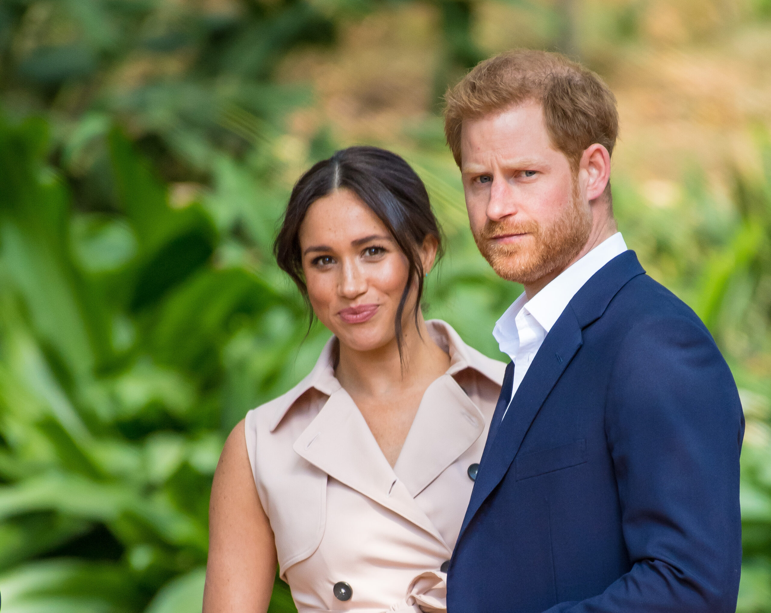 Meghan Markle and Prince Harry looking at the camera