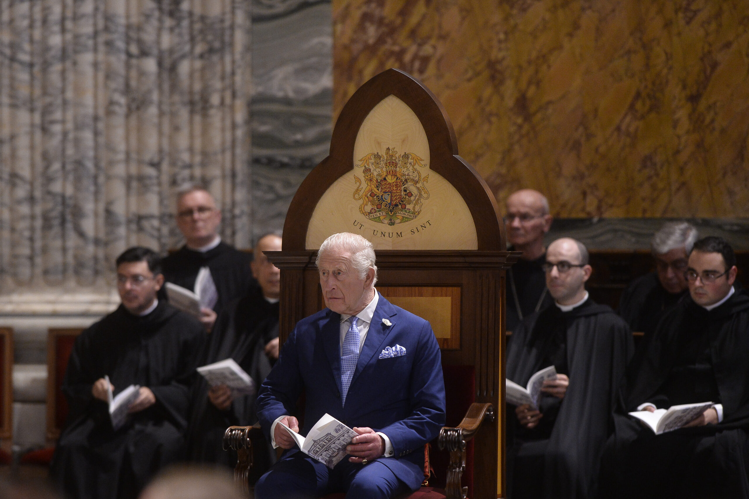 King Charles sat on throne-like seat in Italy