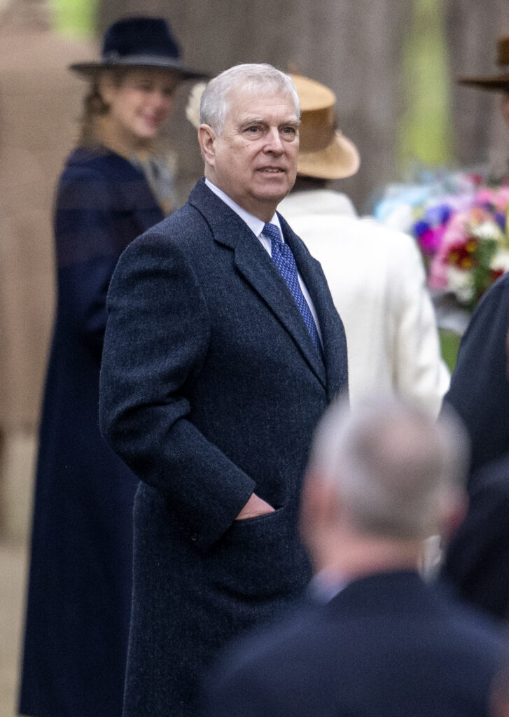 Prince Andrew wearing a long blue jacket