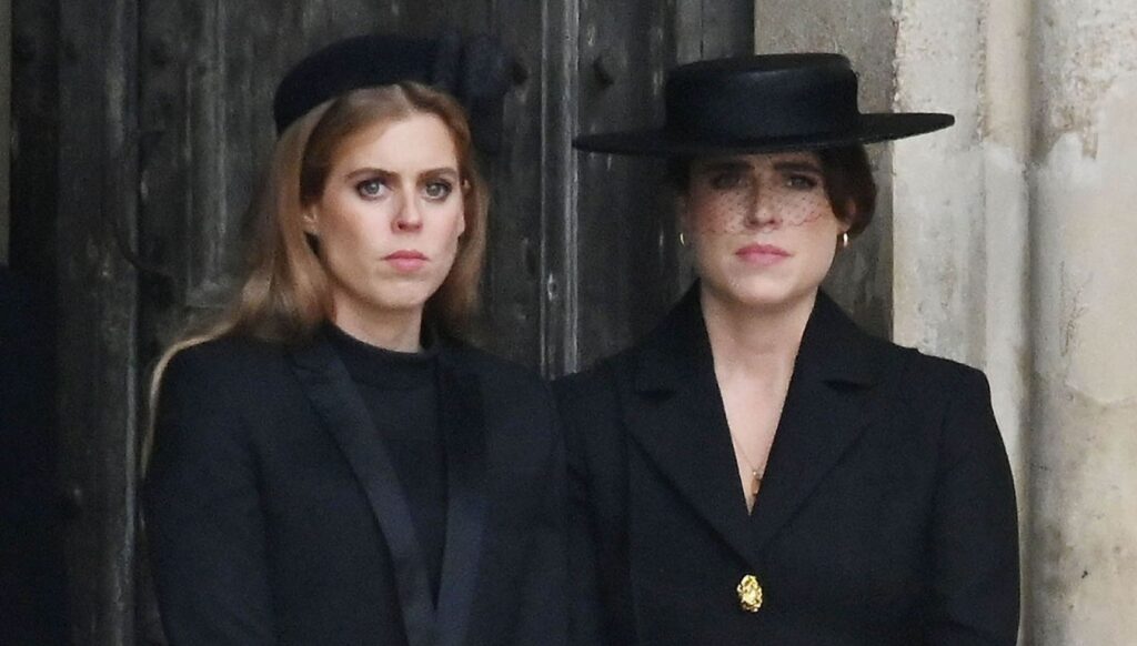 Princess Beatrice and Princess Eugenie looking solemn at the queen's funeral