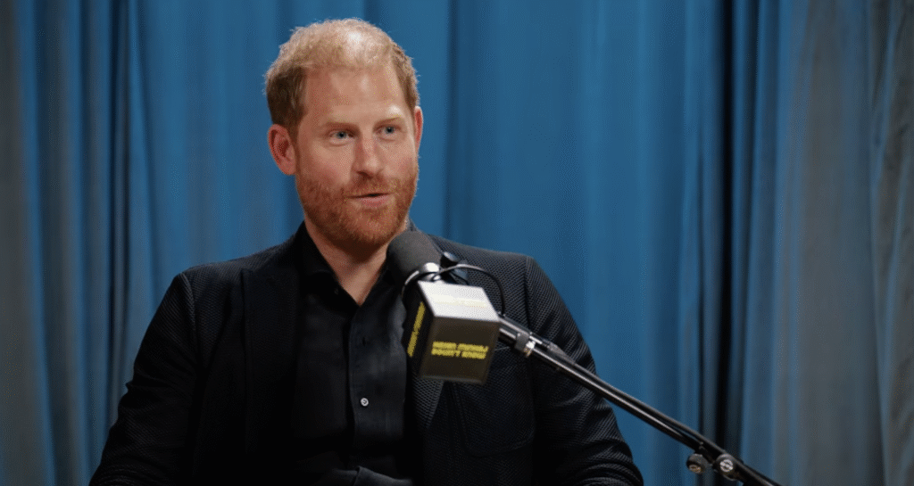 Prince Harry on podcast in black suit jacket