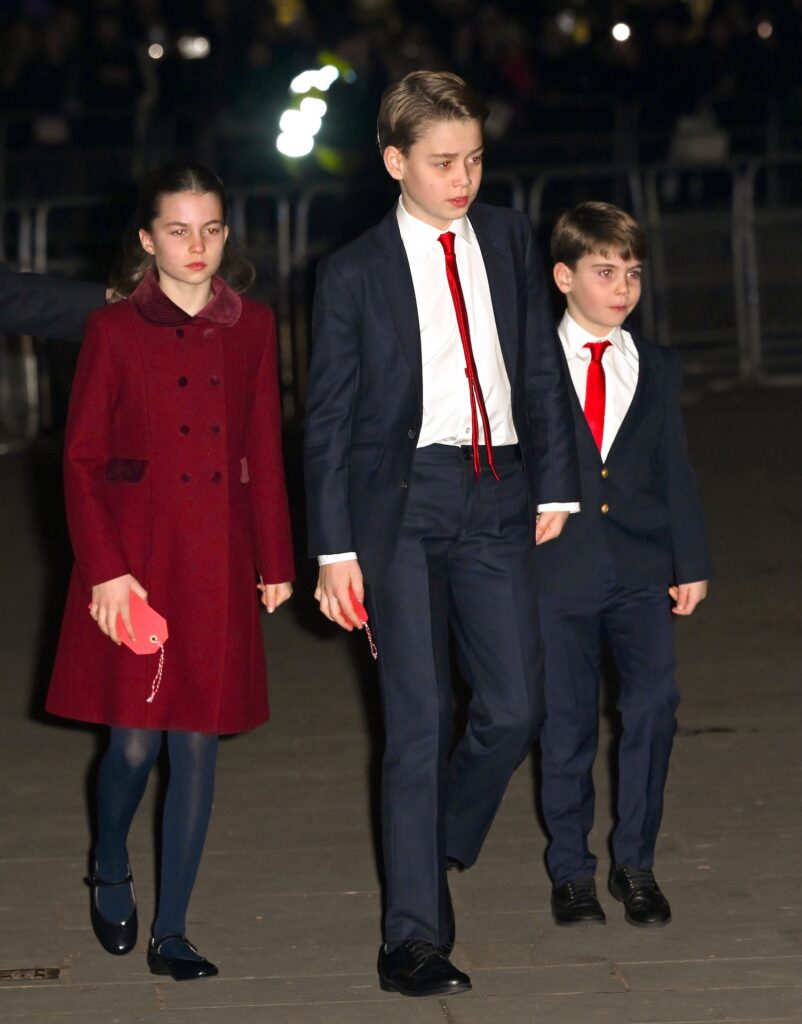 Princess Charlotte and Princes Louis and George walking together 