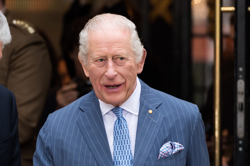 King Charles walking in blue suit