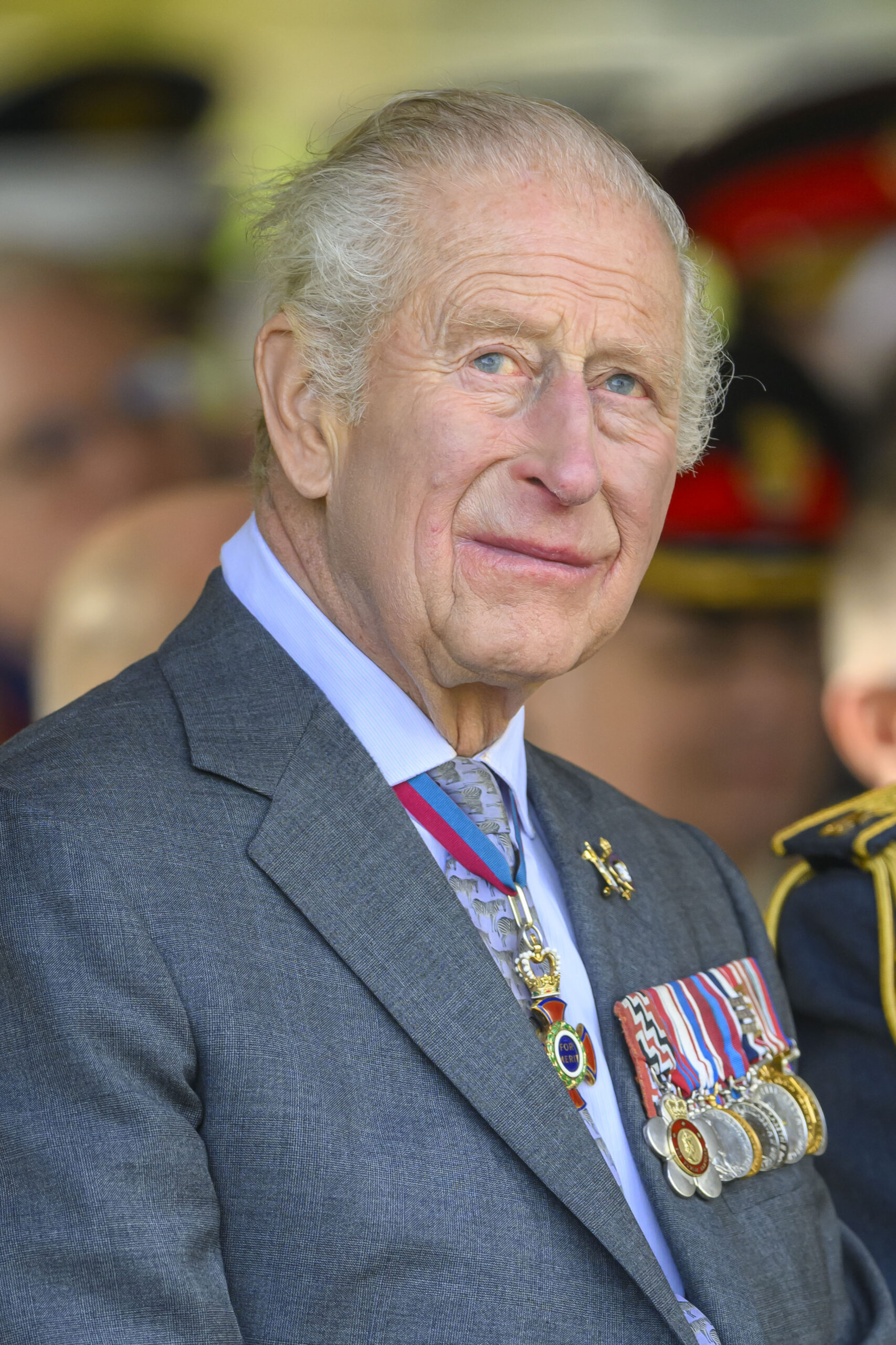 King Charles sitting down