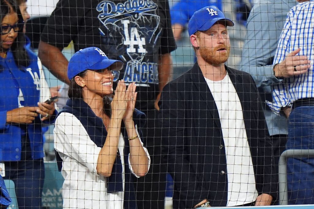 Meghan Markle and Prince Harry cheering at Dodgers game