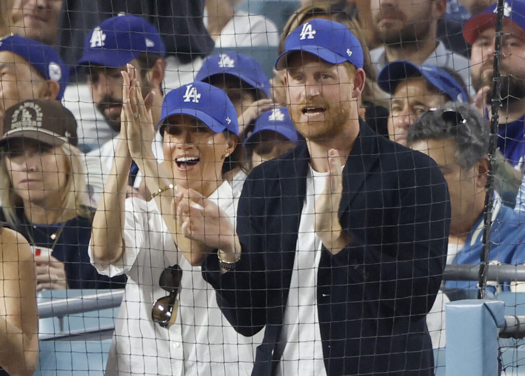 Meghan Markle and Prince Harry cheering at Dodgers game