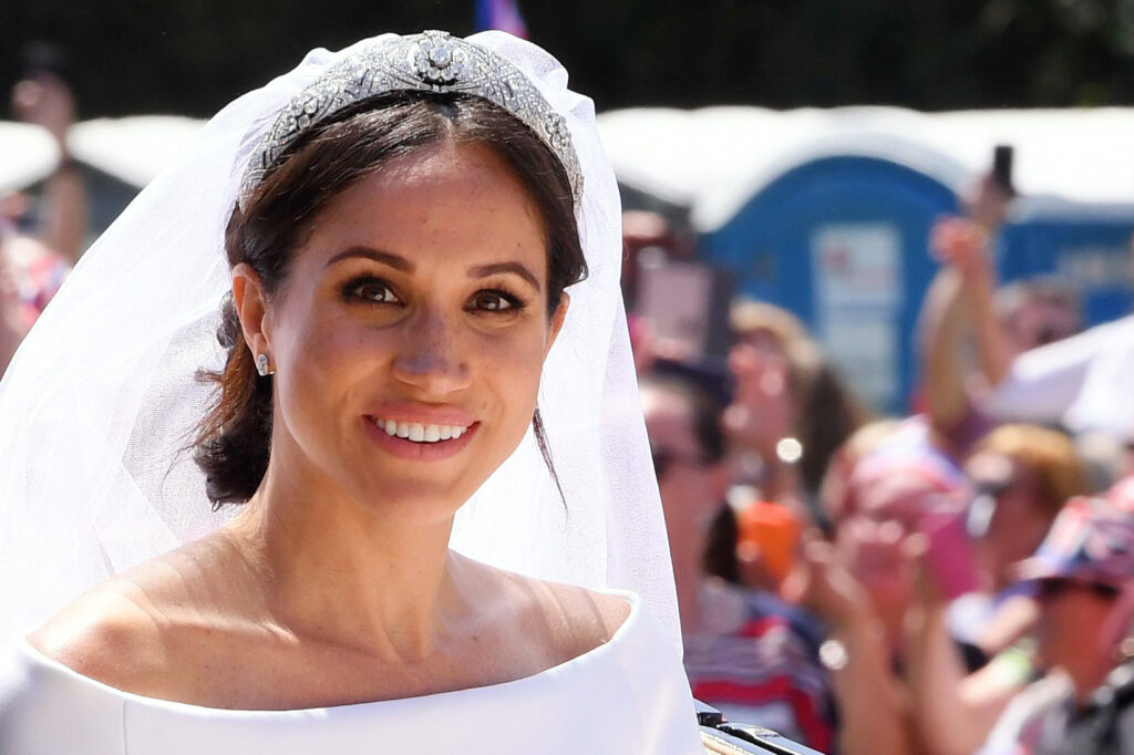 Meghan Markle smiling wearing a tiara on her wedding day