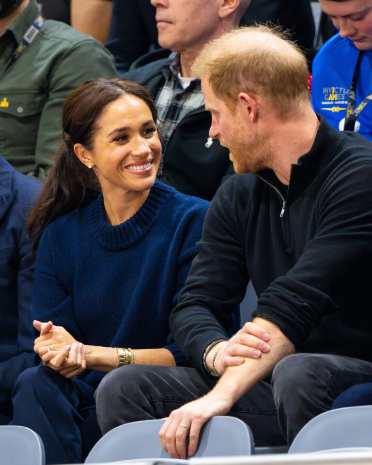 Prince Harry and Meghan Markle 'very much in love' in adorable PDA