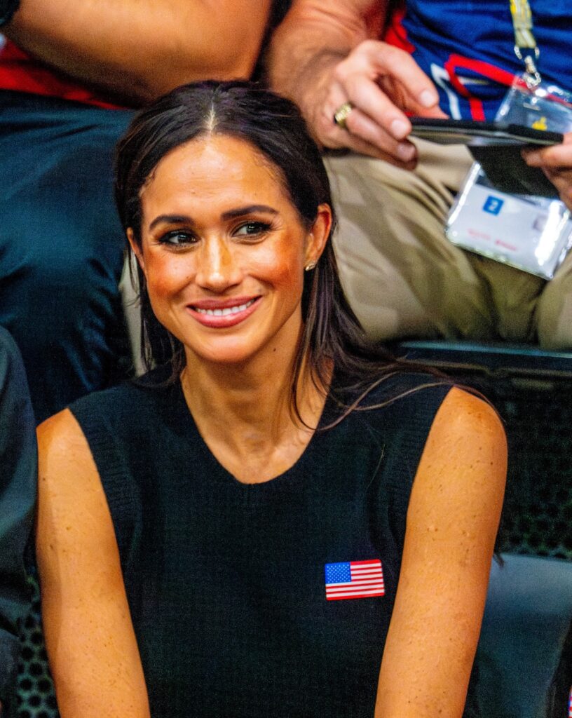 Meghan Markle smiling at an event