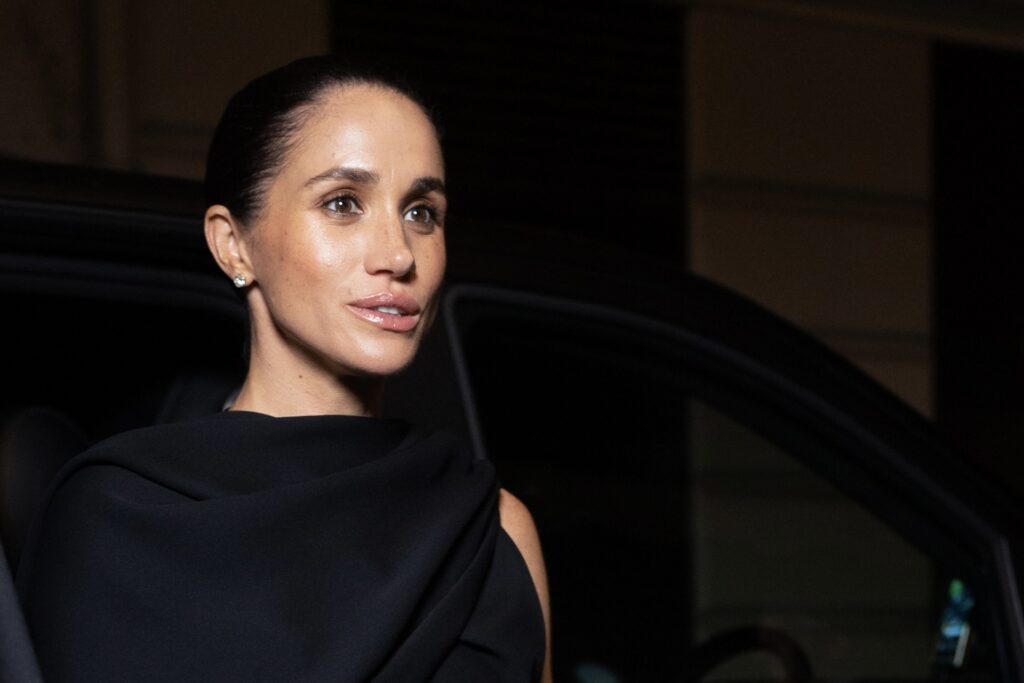 Meghan Markle in black dress at an event