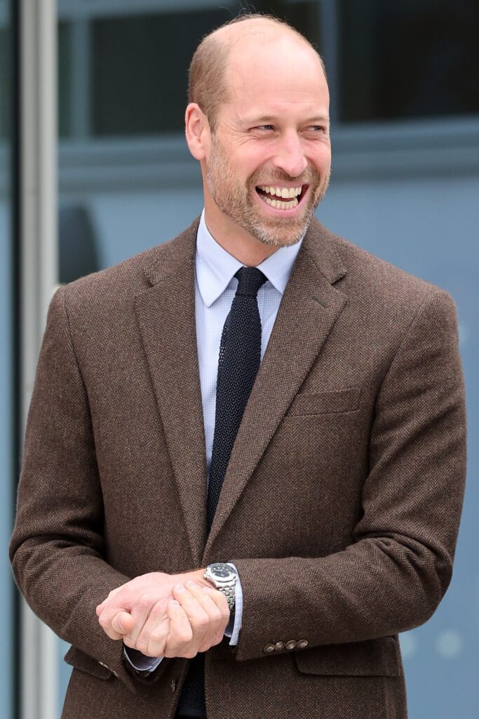 Prince William in brown suit jacket laughing