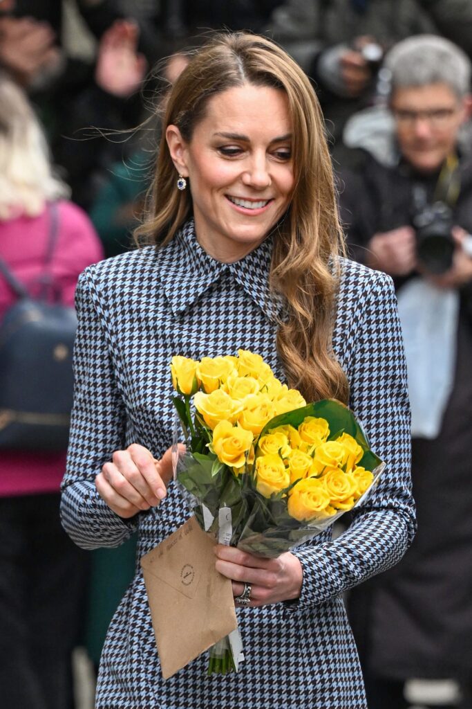 Kate Middleton smiling with flowers