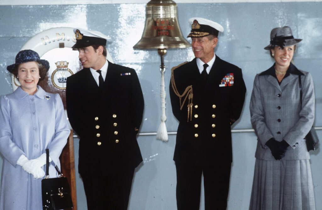 Queen Elizabeth II, Prince Andrew, Prince Philip, Princess Anne smiling 