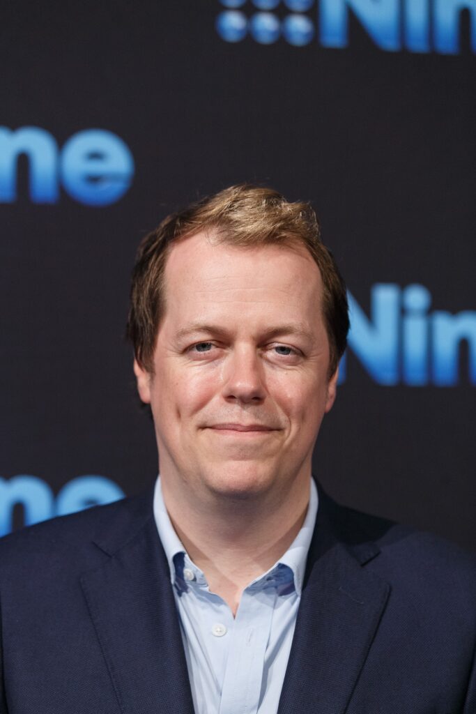Tom Parker Bowles at an event smiling at camera