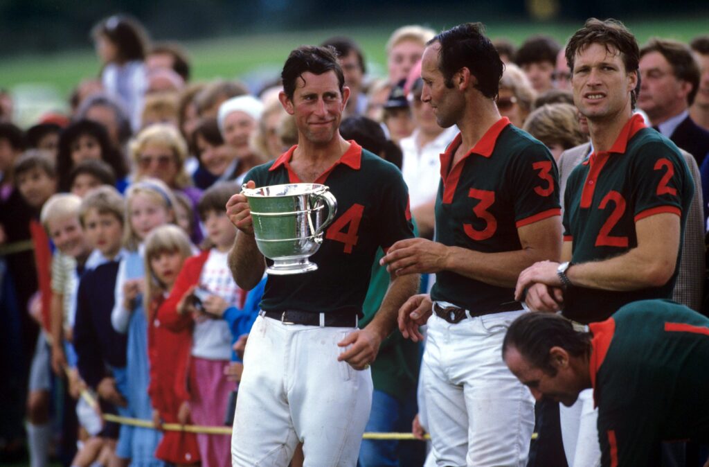 Prince Charles in 1987, proudly holding a trophy at Cowdray Park