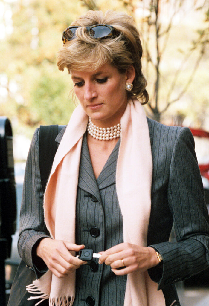 Princess Diana in a suit and pink scarf