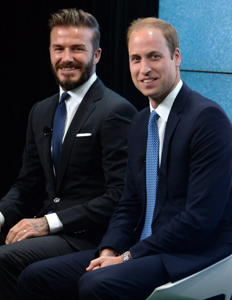 David Beckham and Prince William smiling 