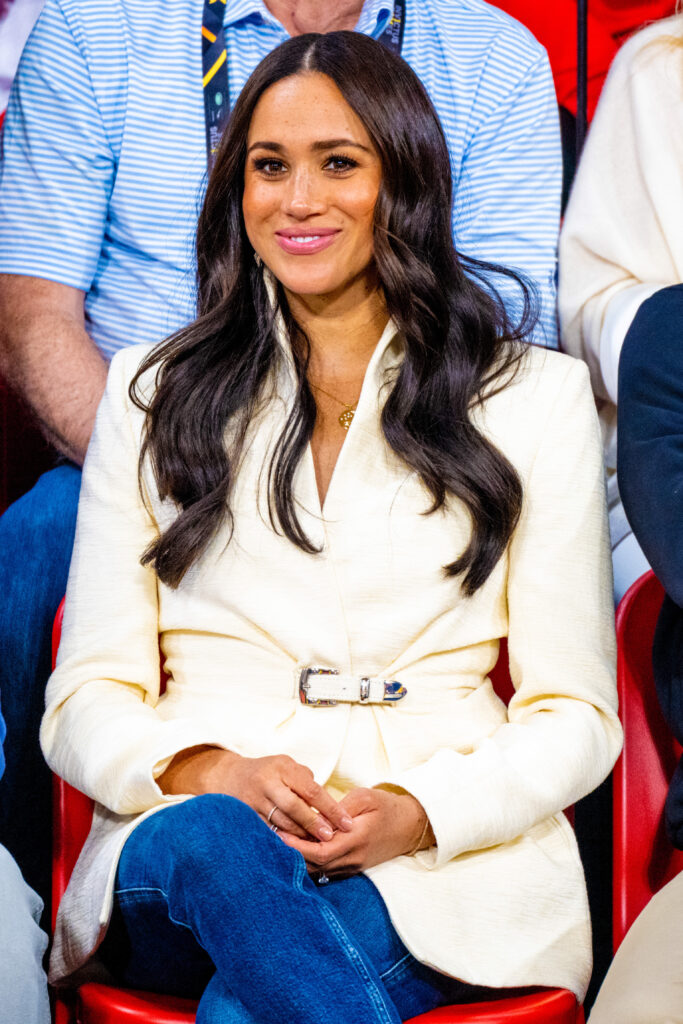 Meghan Markle sitting down and smiling