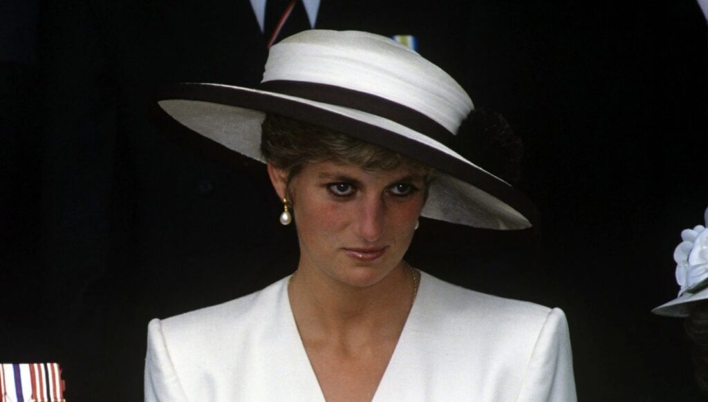 Princess Diana in a white outfit and white hat