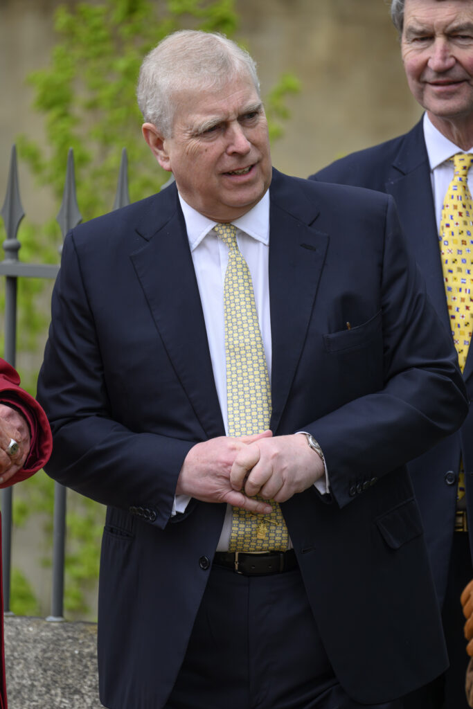 Prince Andrew in a suit and yellow tie
