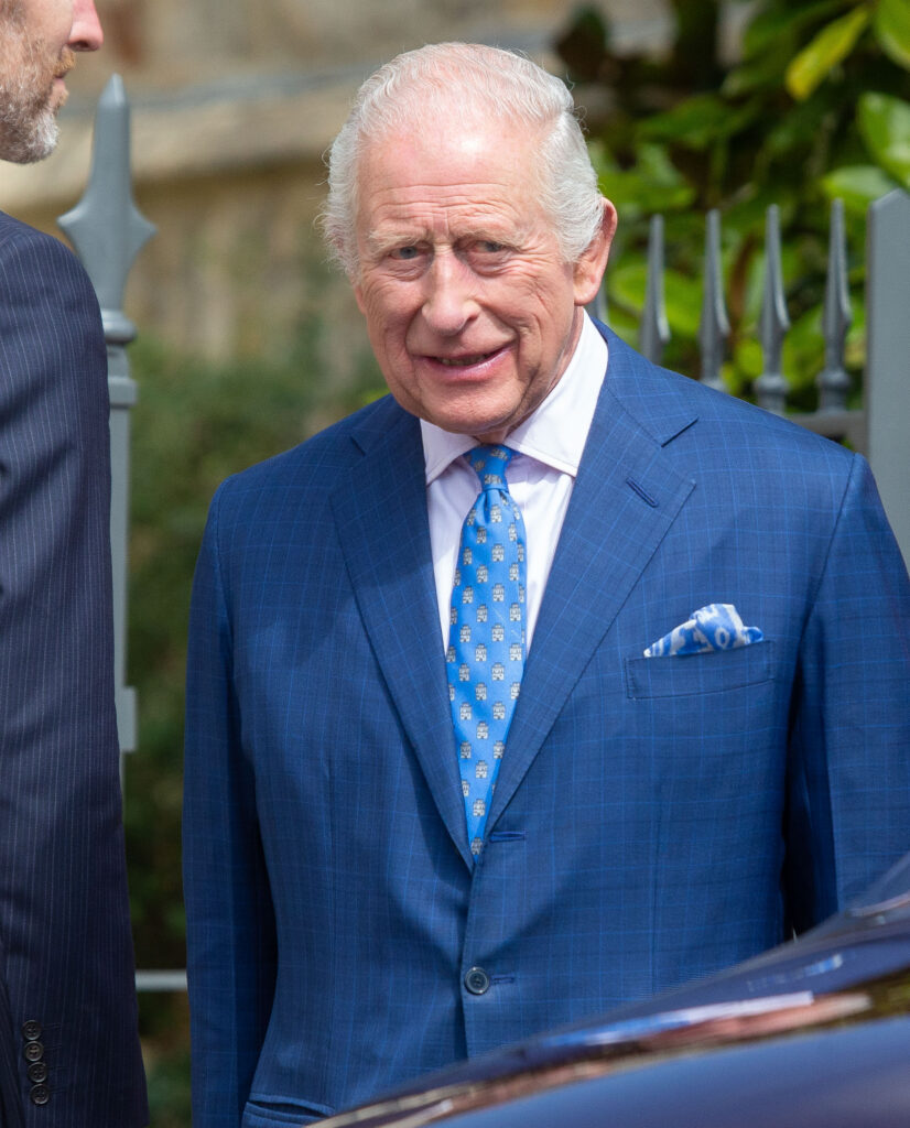 King Charles standing in blue suit
