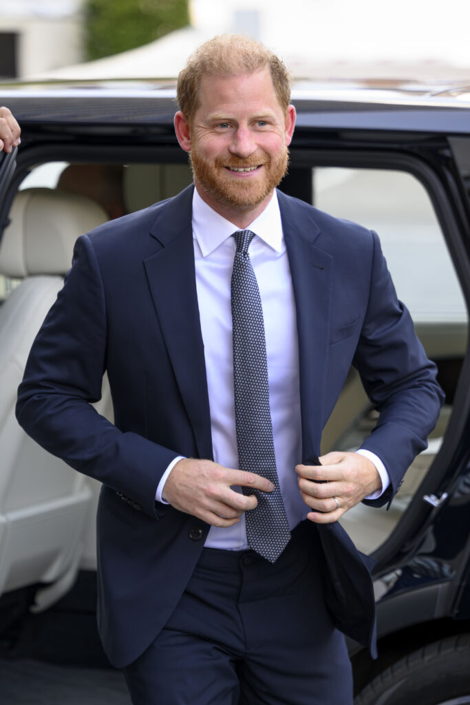 Prince Harry smiling in suit