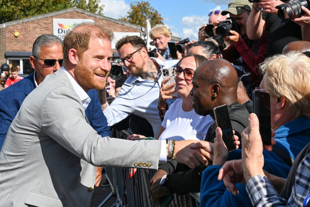 Prince Harry greeting well-wishers in the UK
