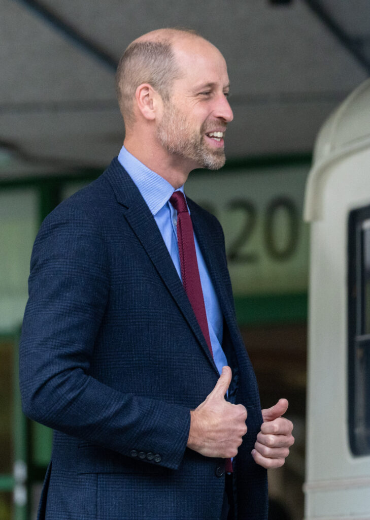 Prince William smiling in a suit