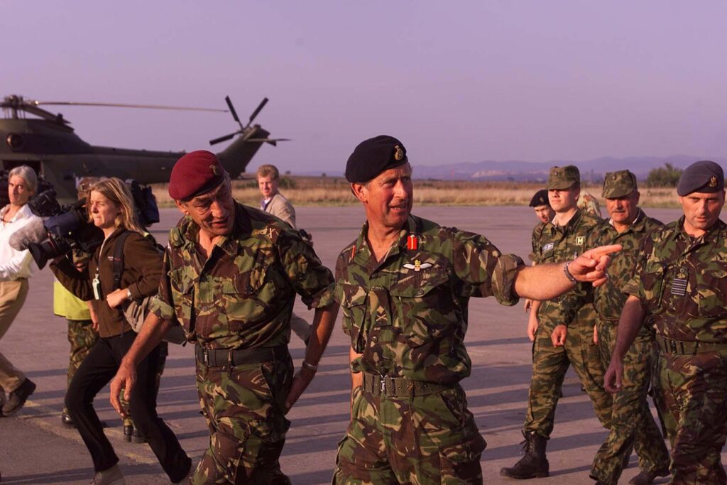 General Mike Jackson And then-Prince Charles in Kosovo, in 1999, wearing army uniform and walking with soldiers