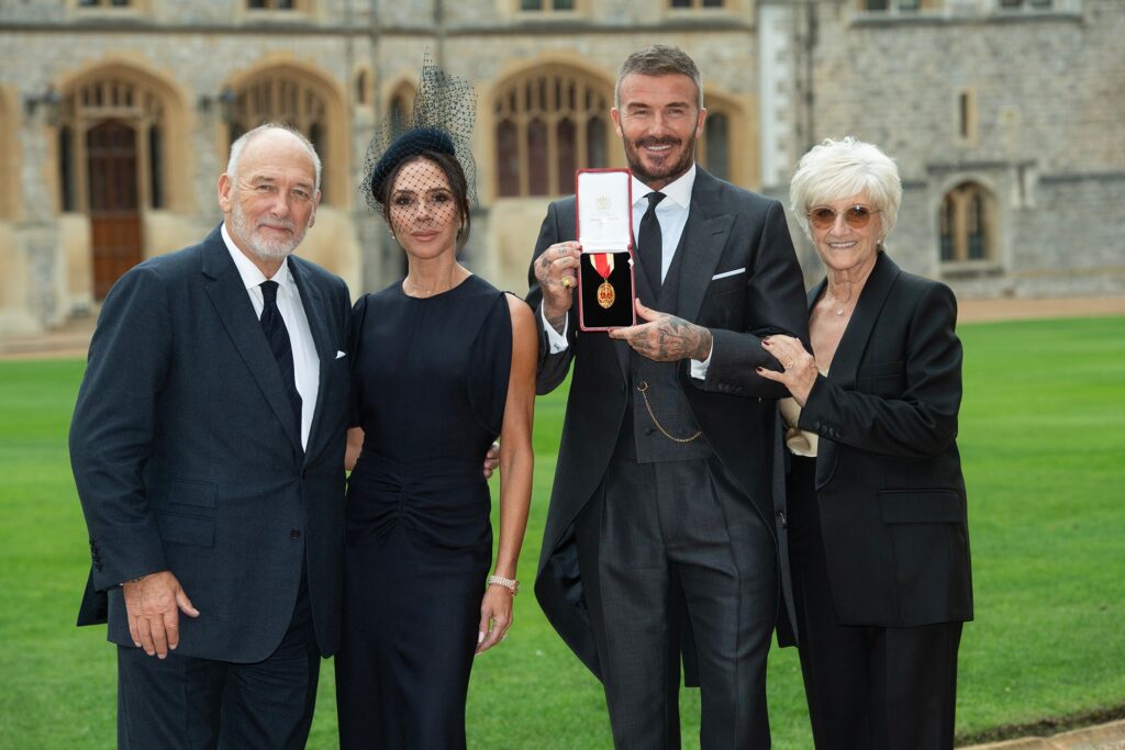David Beckham with Victoria and his parents after receiving knighthood