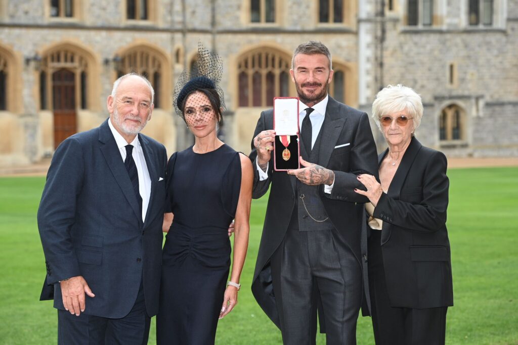 David Beckham with his knighthood alongside Victoria