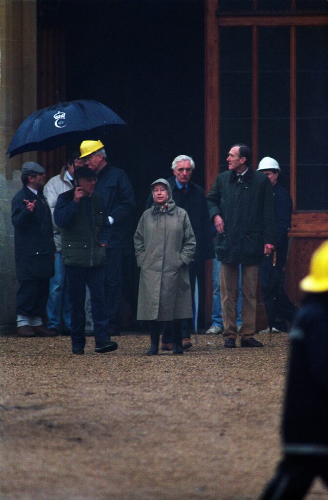 Queen Elizabeth upset staring at the fire at Windsor Castle