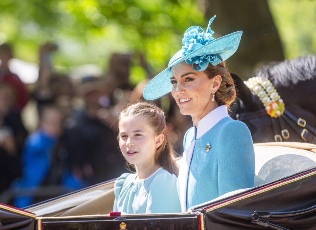 Kate Middleton and Princess Charlotte driving in carriage together smiling