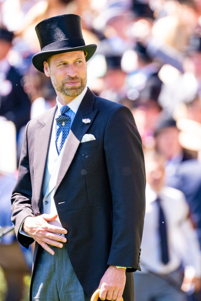 Prince William wearing a suit and a top hat