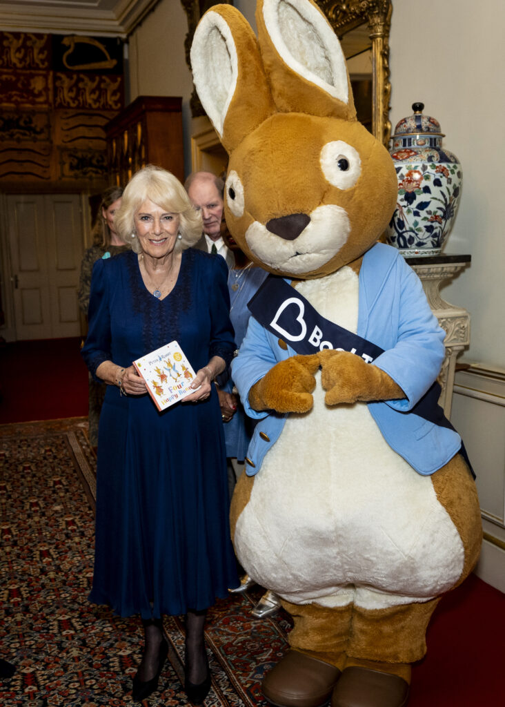 Queen Camilla with someone dressed up as Peter Rabbit at Clarence House