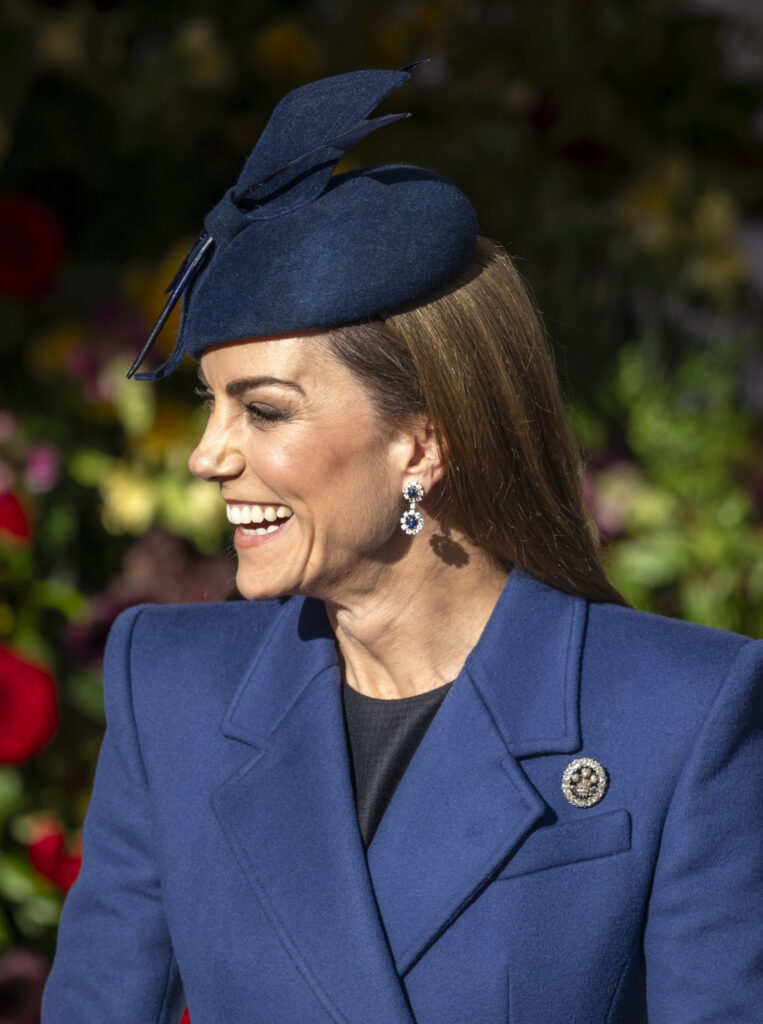 Princess Kate smiling wearing a blue ensemble
