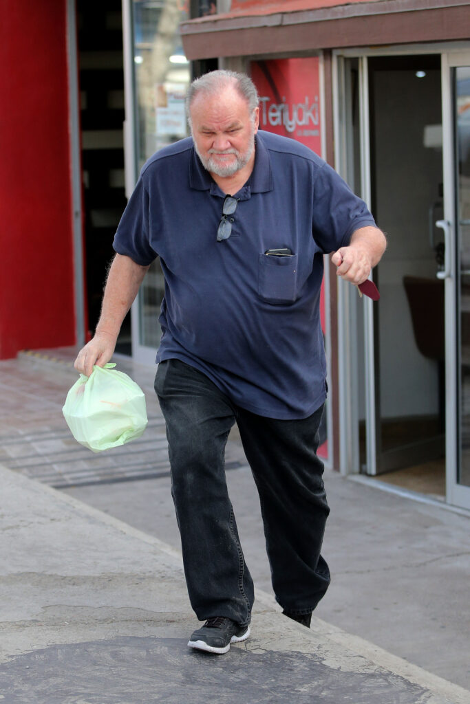 Meghan Markle's father Thomas walking out of shop