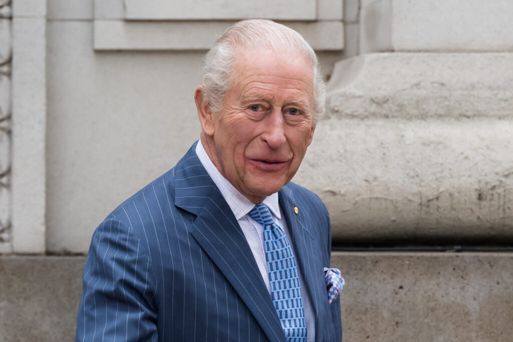 King Charles walking and looking at camera