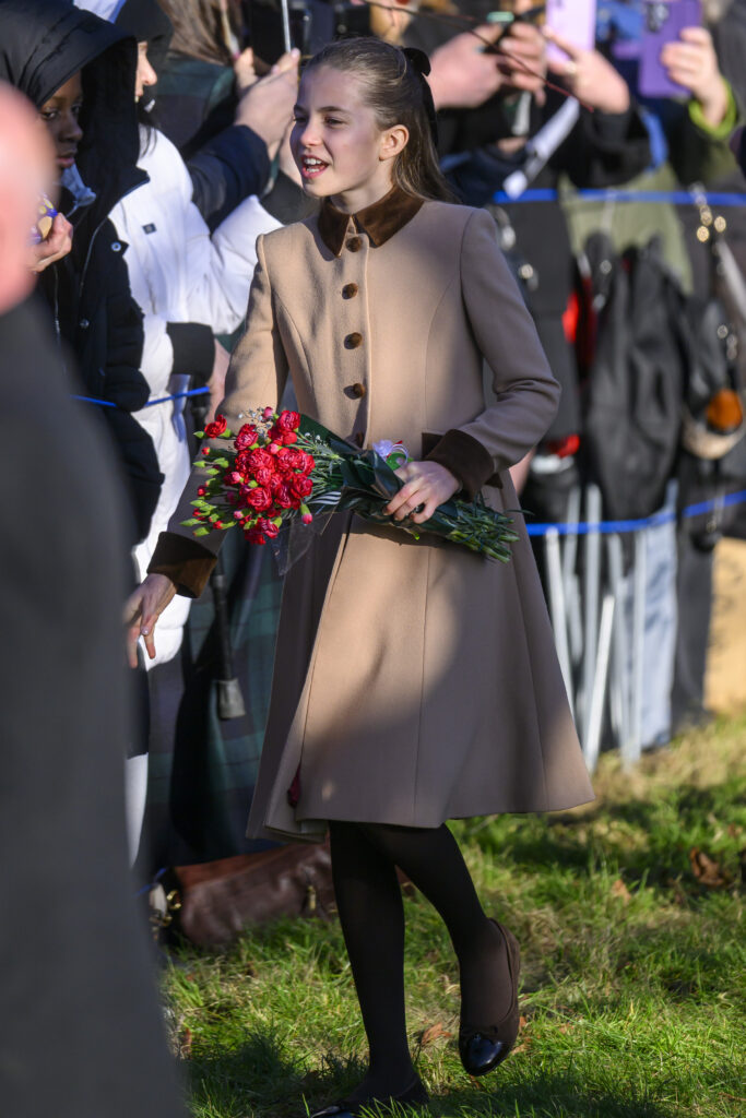 Princess Charlotte holding flowers during Christmas Day walkabout