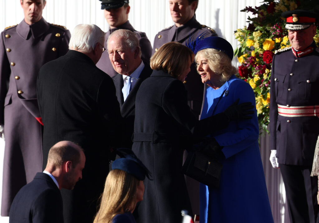 King Charles greeting President Frank-Walter Steinmeier beside Queen Camilla smiling and greeting Germany's First Lady Elke Büdenbender