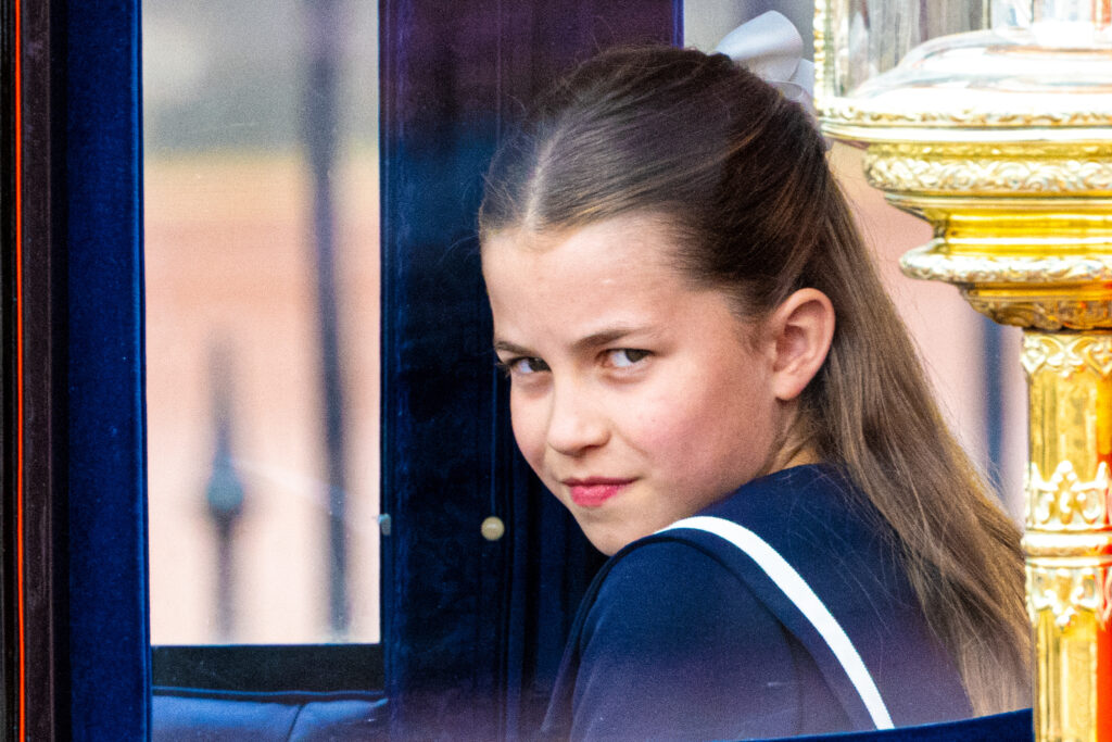 Princess Charlotte smiling out of a carriage