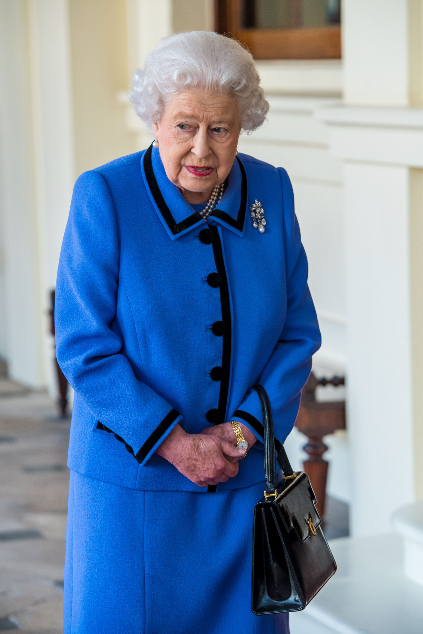 Queen Elizabeth wearing a blue suit