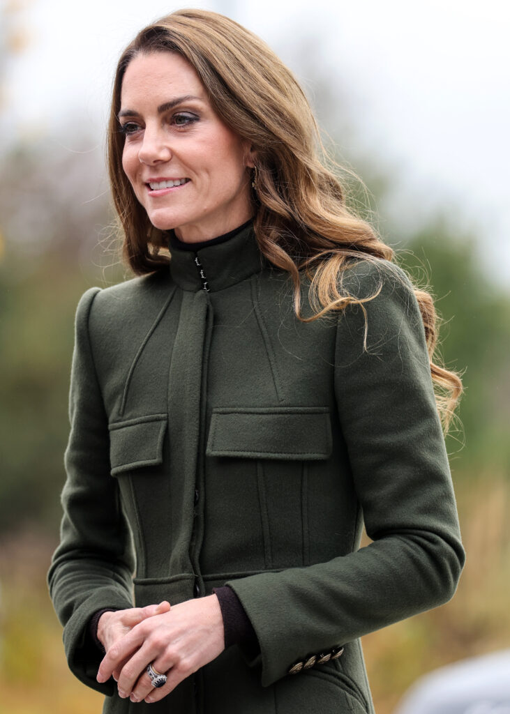 Princess Kate smiling wearing a green jacket