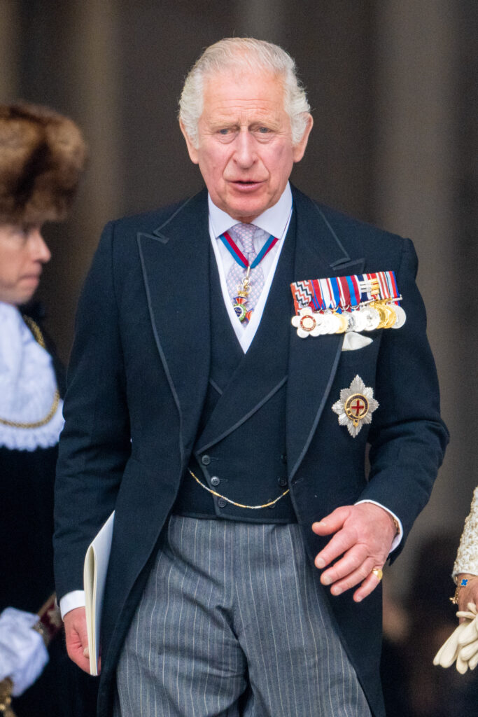 King Charles walking in suit