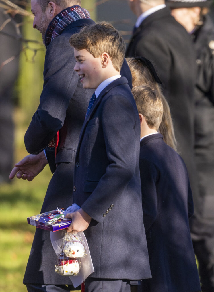 Prince George on Christmas Day carrying presents at Sandringham